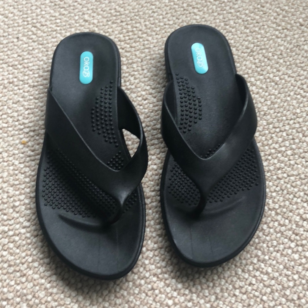 Brand new. Worn once. Black Oka B. Flip flops